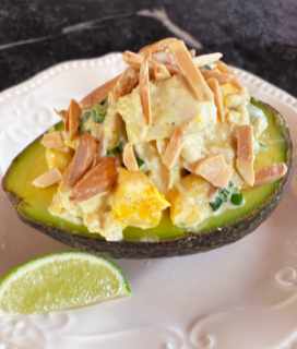 Image of curry chicken salad on half an avocado