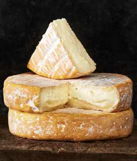 Image of two wheels of Marin French Cheese Co.’s Golden Gate