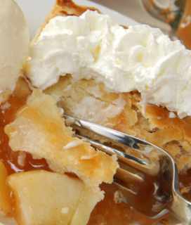 Image of the close up of a slice of Apple Slab Pie with whipped cream