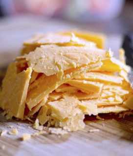 Image of a pile of sliced Tillamook cheddar cheese