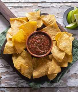 Image of Casa Chicas Tortilla Chips with salsa and lime