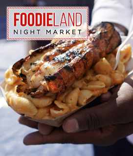FoodieLand Night Market logo with image of someone holding grilled lobster tail over pasta. 