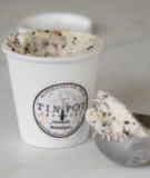 Carton of Tin Pot Creamery Cookie Monster Ice Cream with scoop