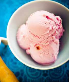 Image of a bowl of Strawberry Ice Cream against a blue background