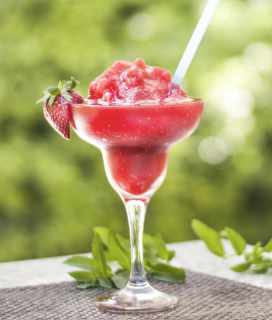 Photo of a Cranberry Grapefruit Frosé on an outdoor table