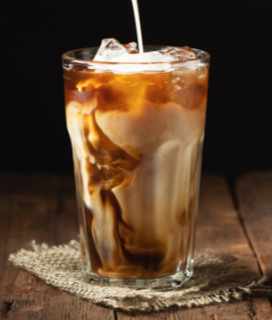 Image of an iced latte made with Califa Barista Blend Oat Milk