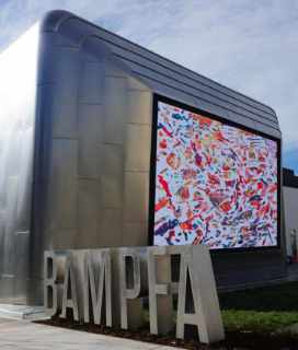 Image of the giant LED screen where they are showing Free Outdoor Films at BAMPFA in Berkeley