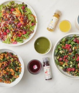 Spread of Urban Remedy salads, juices and shots