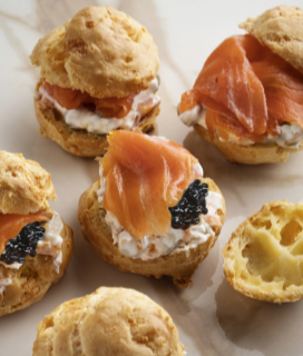 Photo of Over-the-Top Gougères with creme fraiche, smoked salmon, and caviar.