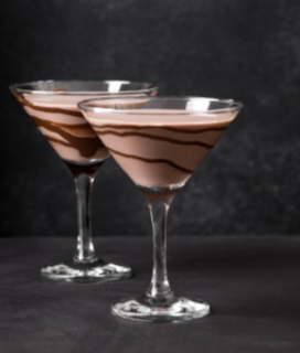 Two Toblerone Cocktails on a dark background