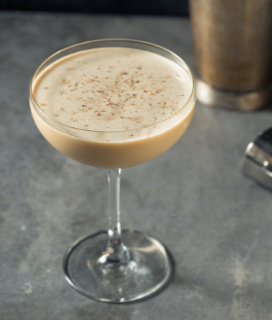 Photo of a Brandy Alexander cocktail on a grey background