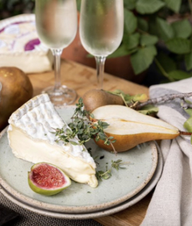 Photo of Fromager d’Affinois brie on a plate with fruit