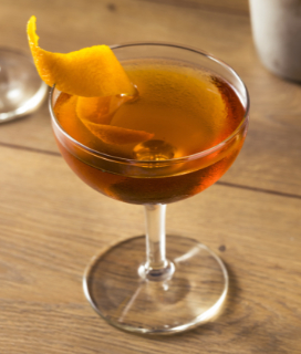 Photo of a Classic Martinez cocktail with a lemon twist