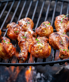Chicken legs on a hot grill with Brazillian Garlic Marinade