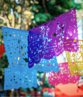 Photo of Mexican cut paper decorations for our Cinco de Mayo Menu