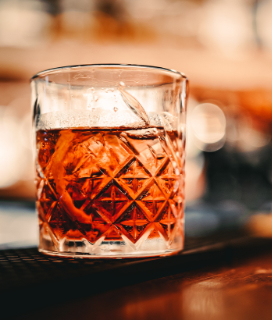 Photo of a Cold Brew Negroni in a rocks glass on a bar