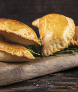 Cornish Pasties on a wooden cutting board