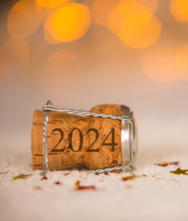 Photo of of champagne cork for New Year's 2024 Holiday Hours
