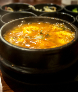 A bowl of Kimchi Sundubo Jjigae (Korean Silken Tofu Stew)